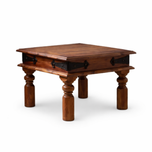 Solid wood coffee table with carved legs and black metal detailing, isolated on a clean background for product display.