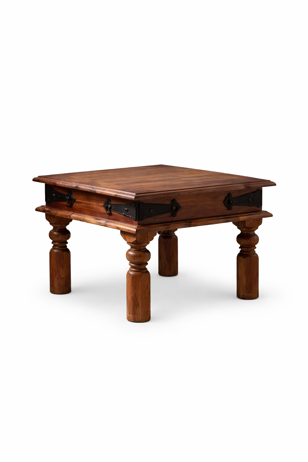 Solid wood coffee table with carved legs and black metal detailing, isolated on a clean background for product display.