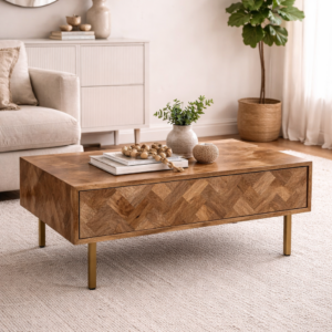 Solid mango wood coffee table with herringbone pattern and metal legs styled in a neutral living room with soft furnishings, rug, and natural décor.